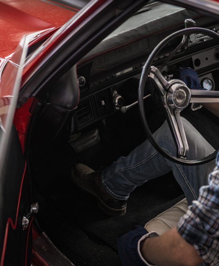 Classic Cars Mechanic Inside Restored American Muscle Car Caucasian Professional Classic Cars Mechanic in His 40s Inside Restored American Muscle Car